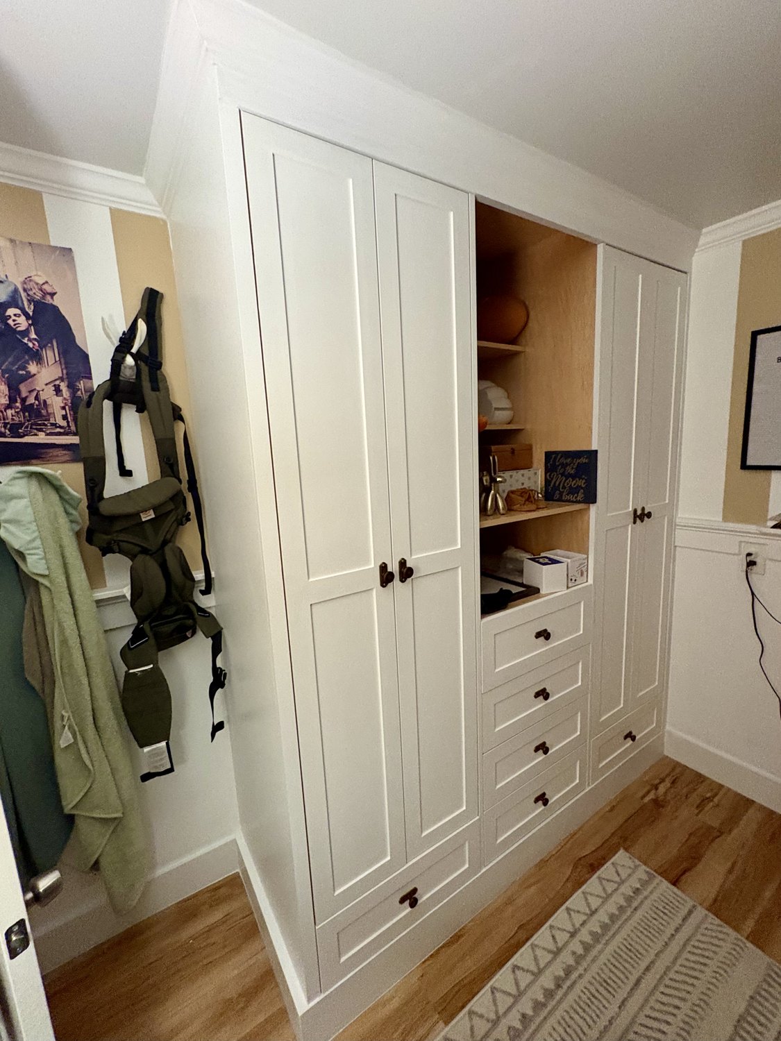 Painted mudroom built-in with hanging space, drawers and cubbies