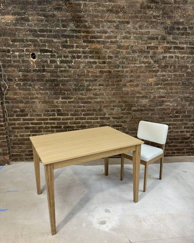 Oak table and chair seen from the end